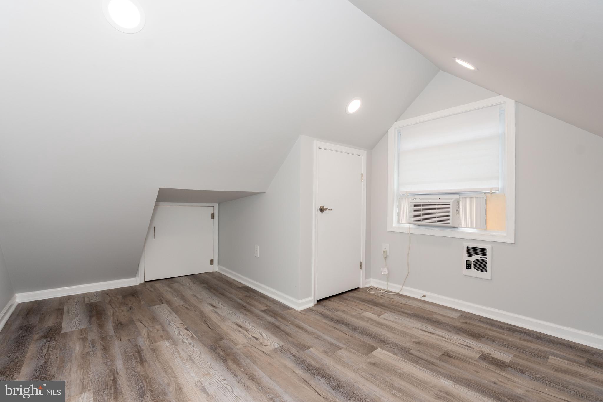 6414 Kenwood Avenue Rosedale, MD 21237 - Photo 29 of 60 a view of a room with wooden floor and white walls