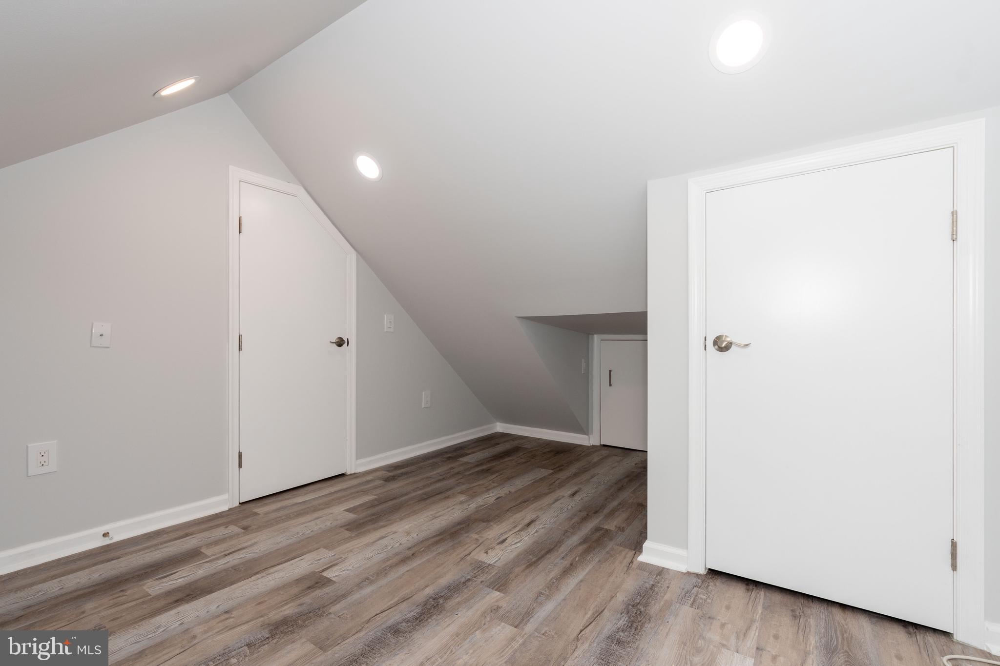 6414 Kenwood Avenue Rosedale, MD 21237 - Photo 31 of 60 an empty room with wooden floor and entrance