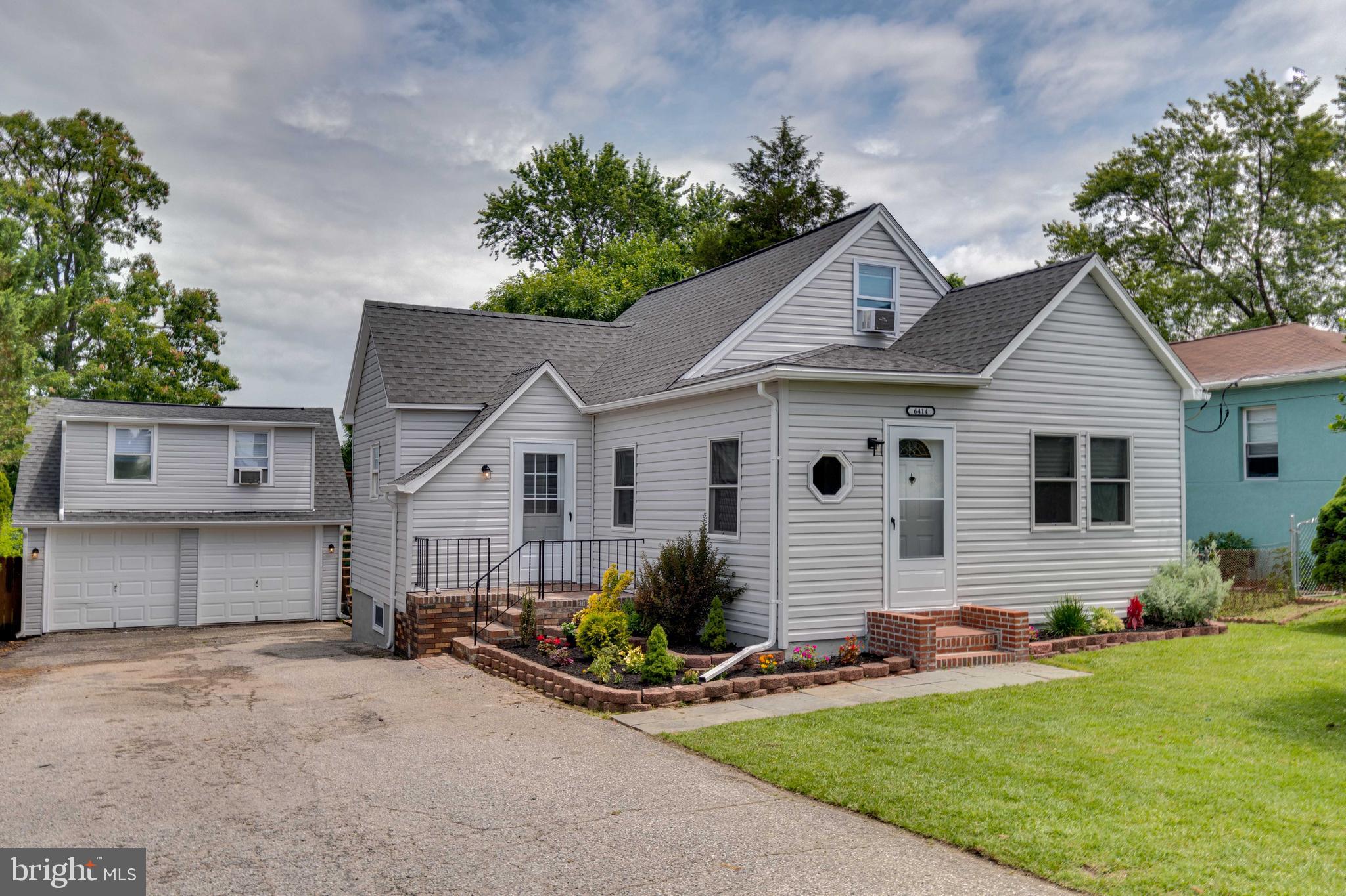 6414 Kenwood Avenue Rosedale, MD 21237 - Photo 4 of 60 a front view of a house with garden
