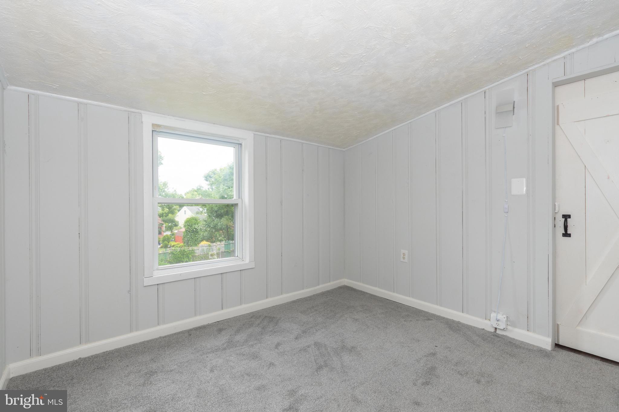 6414 Kenwood Avenue Rosedale, MD 21237 - Photo 42 of 60 an empty room with windows