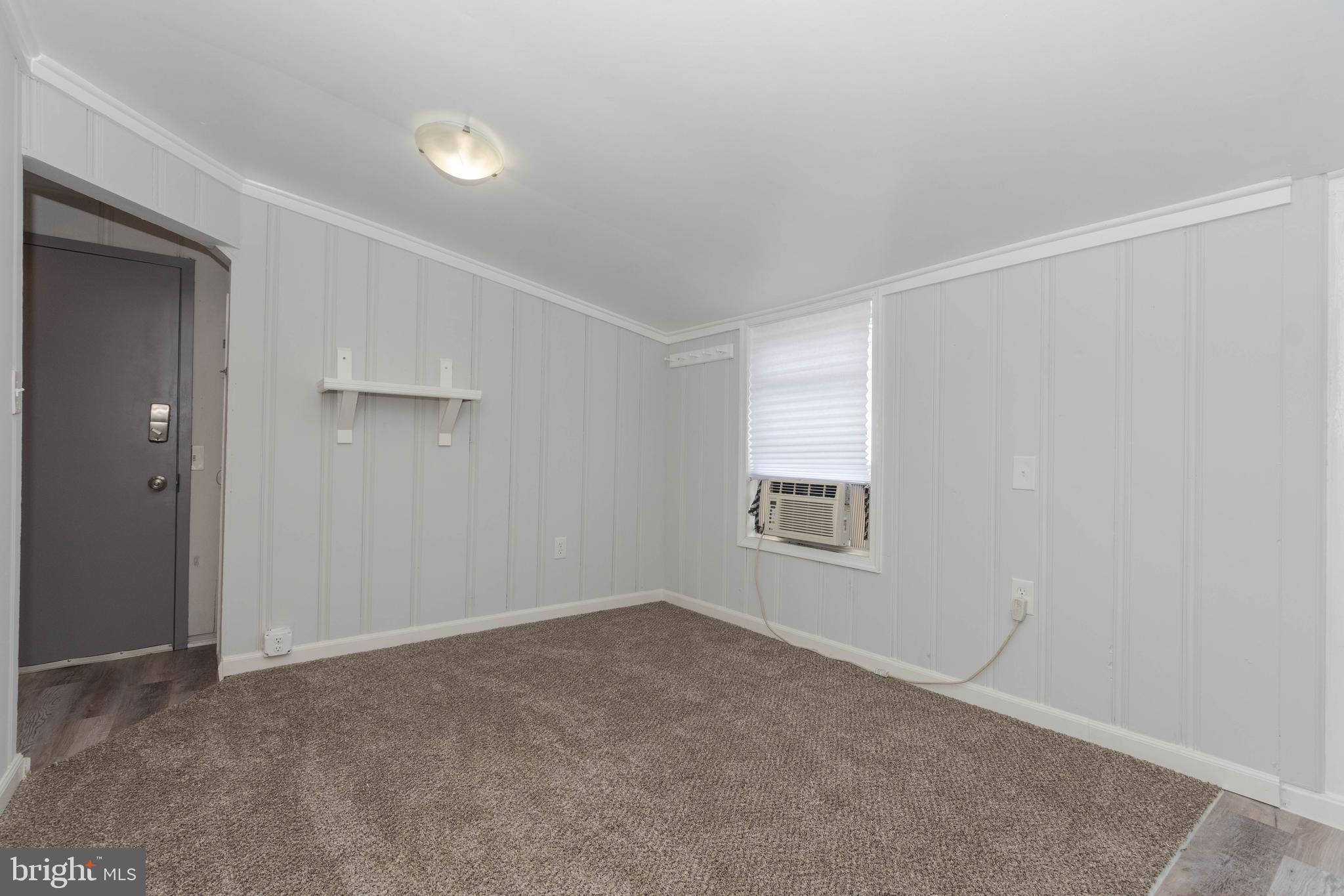 6414 Kenwood Avenue Rosedale, MD 21237 - Photo 49 of 60 an empty room with windows