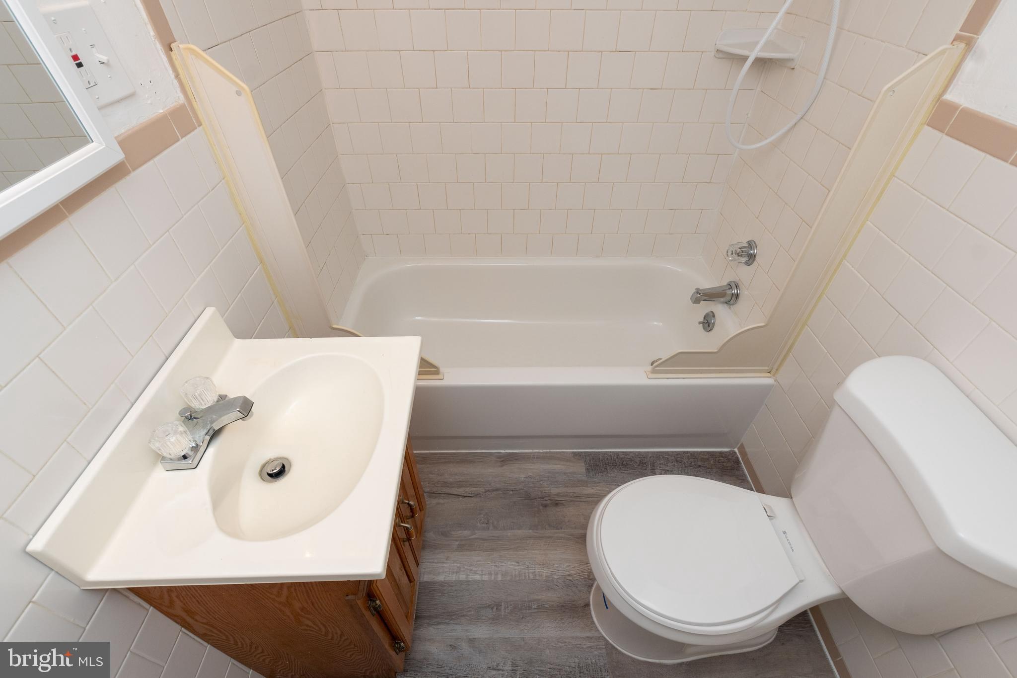 6414 Kenwood Avenue Rosedale, MD 21237 - Photo 50 of 60 a bathroom with a toilet and a sink