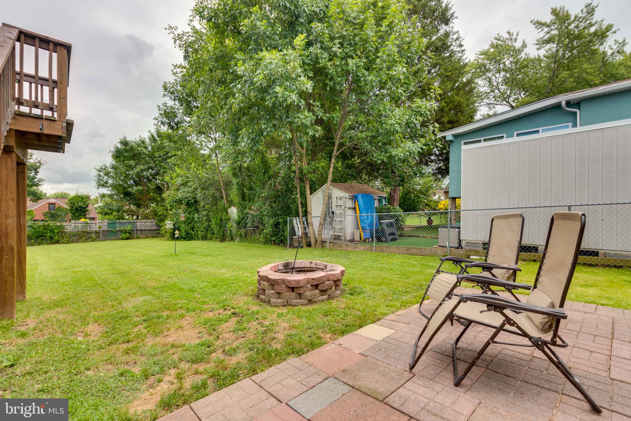6414 Kenwood Avenue Rosedale, MD 21237 - Photo 57 of 60 a backyard of a house with table and chairs