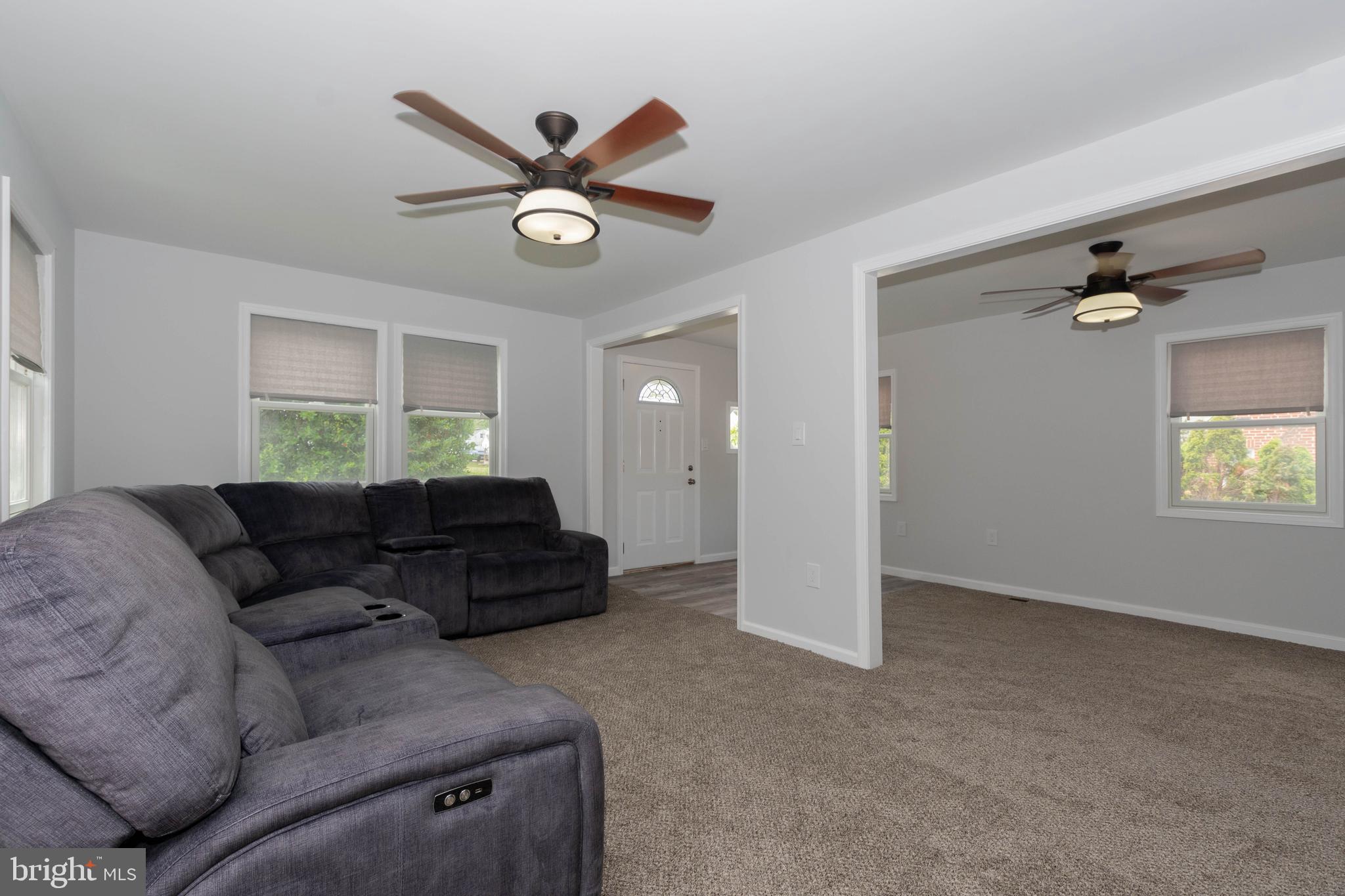 6414 Kenwood Avenue Rosedale, MD 21237 - Photo 6 of 60 a living room with furniture and a window