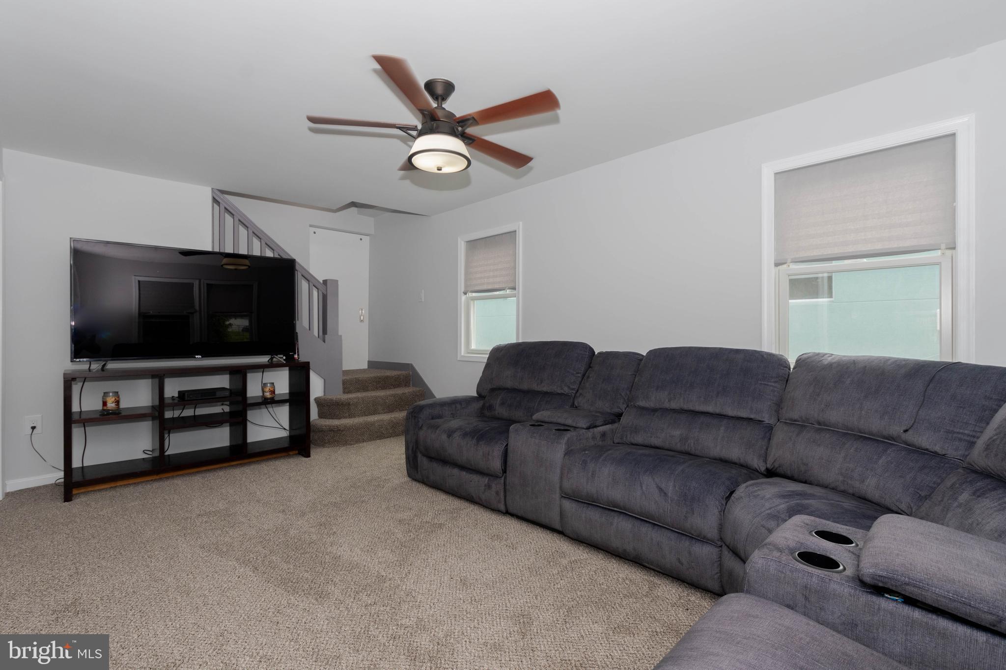 6414 Kenwood Avenue Rosedale, MD 21237 - Photo 7 of 60 a living room with furniture and a flat screen tv