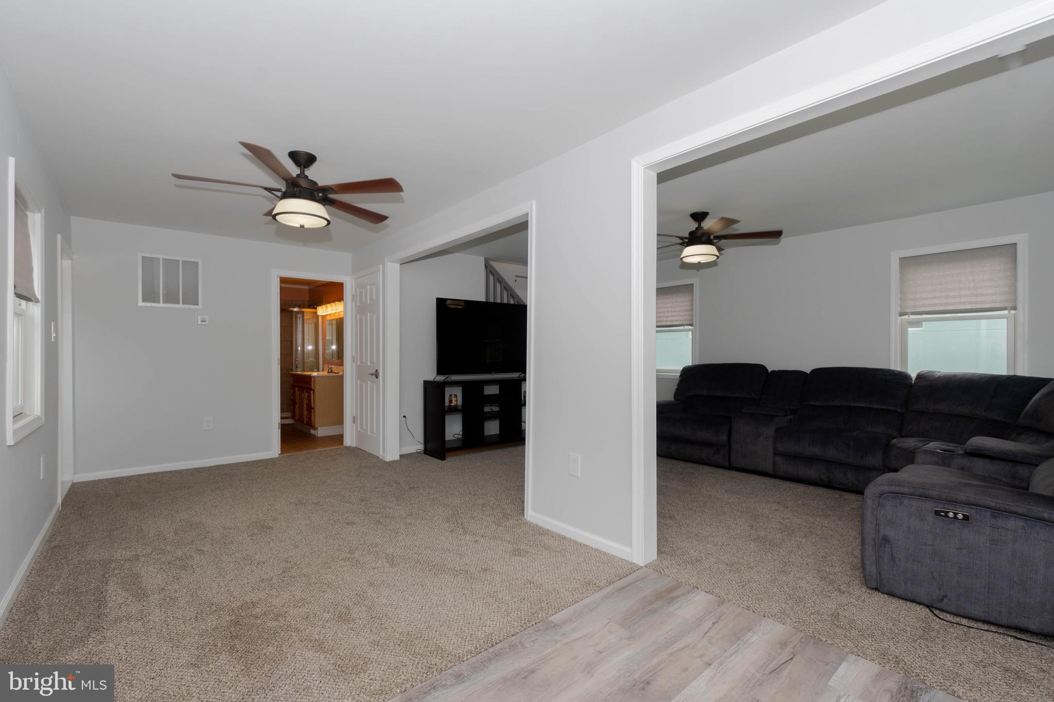 6414 Kenwood Avenue Rosedale, MD 21237 - Photo 9 of 60 a living room with furniture and a flat screen tv