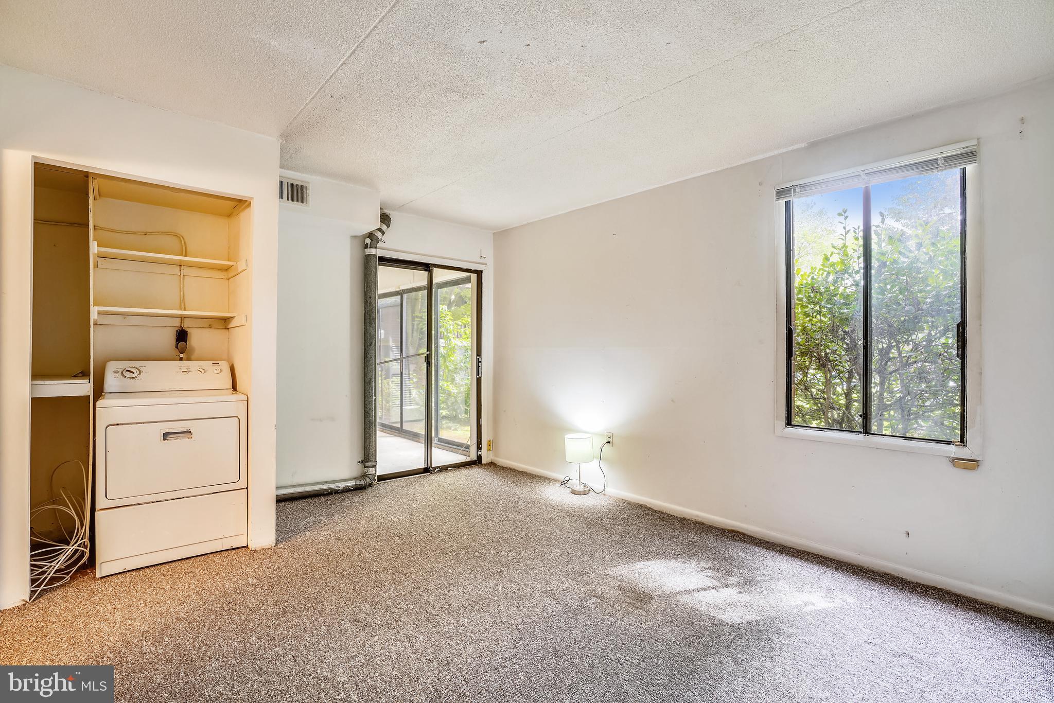 5234 West Running Brook Road, Unit 102 Columbia, MD 21044 - Photo 18 of 44 Master bedroom has slider to enclosed porch
