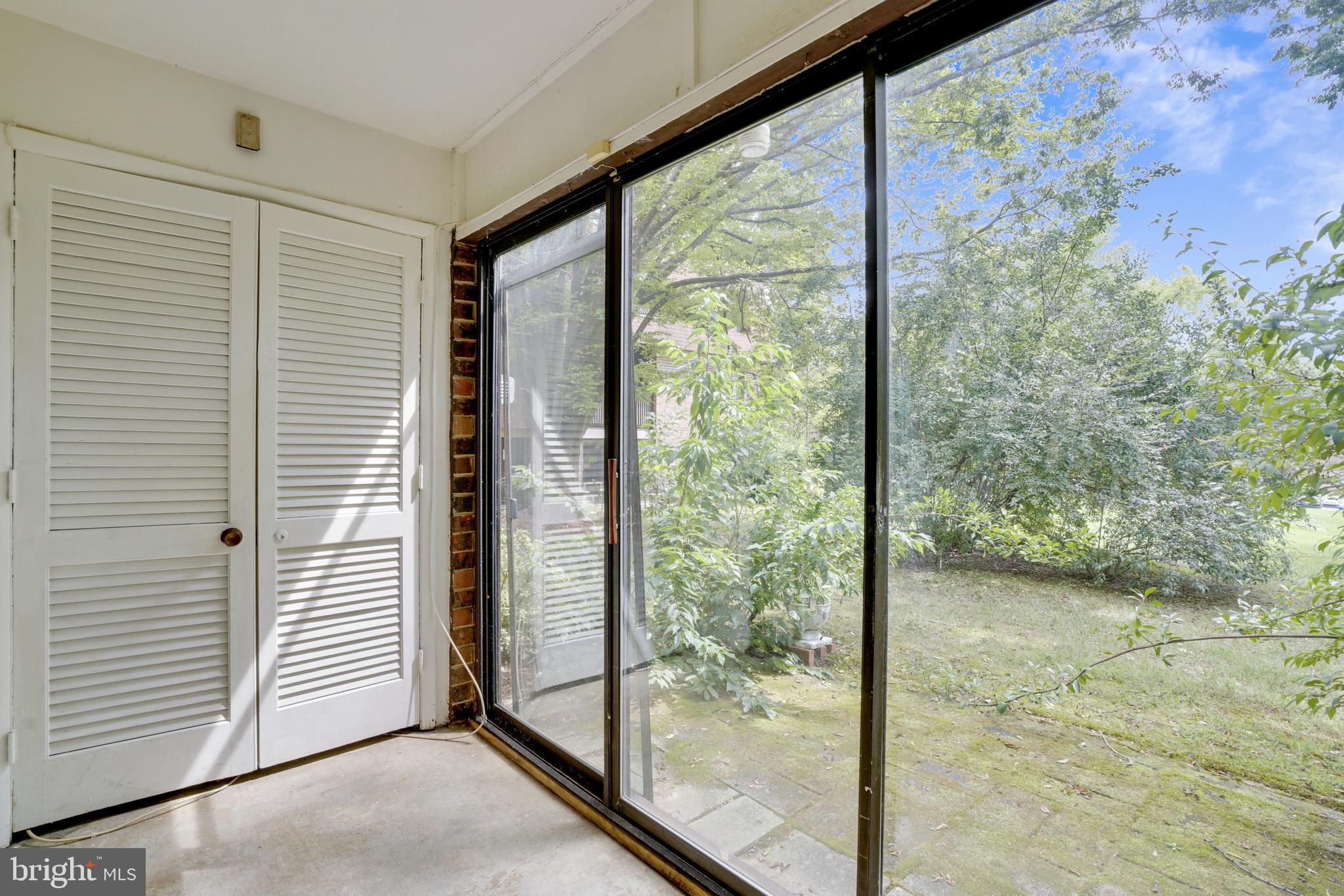 5234 West Running Brook Road, Unit 102 Columbia, MD 21044 - Photo 26 of 44 Enclosed porch overlooking community courtyard