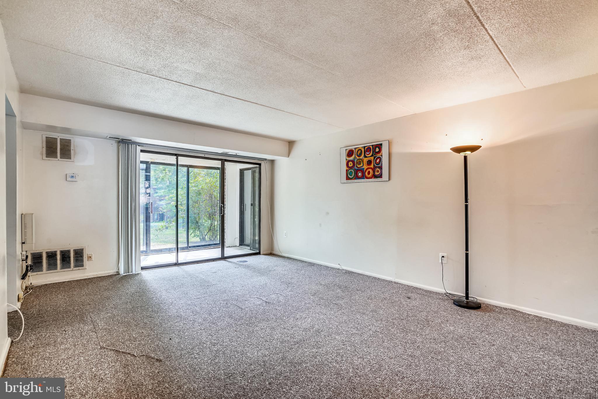 5234 West Running Brook Road, Unit 102 Columbia, MD 21044 - Photo 6 of 44 Living room w/ slider to enclosed porch