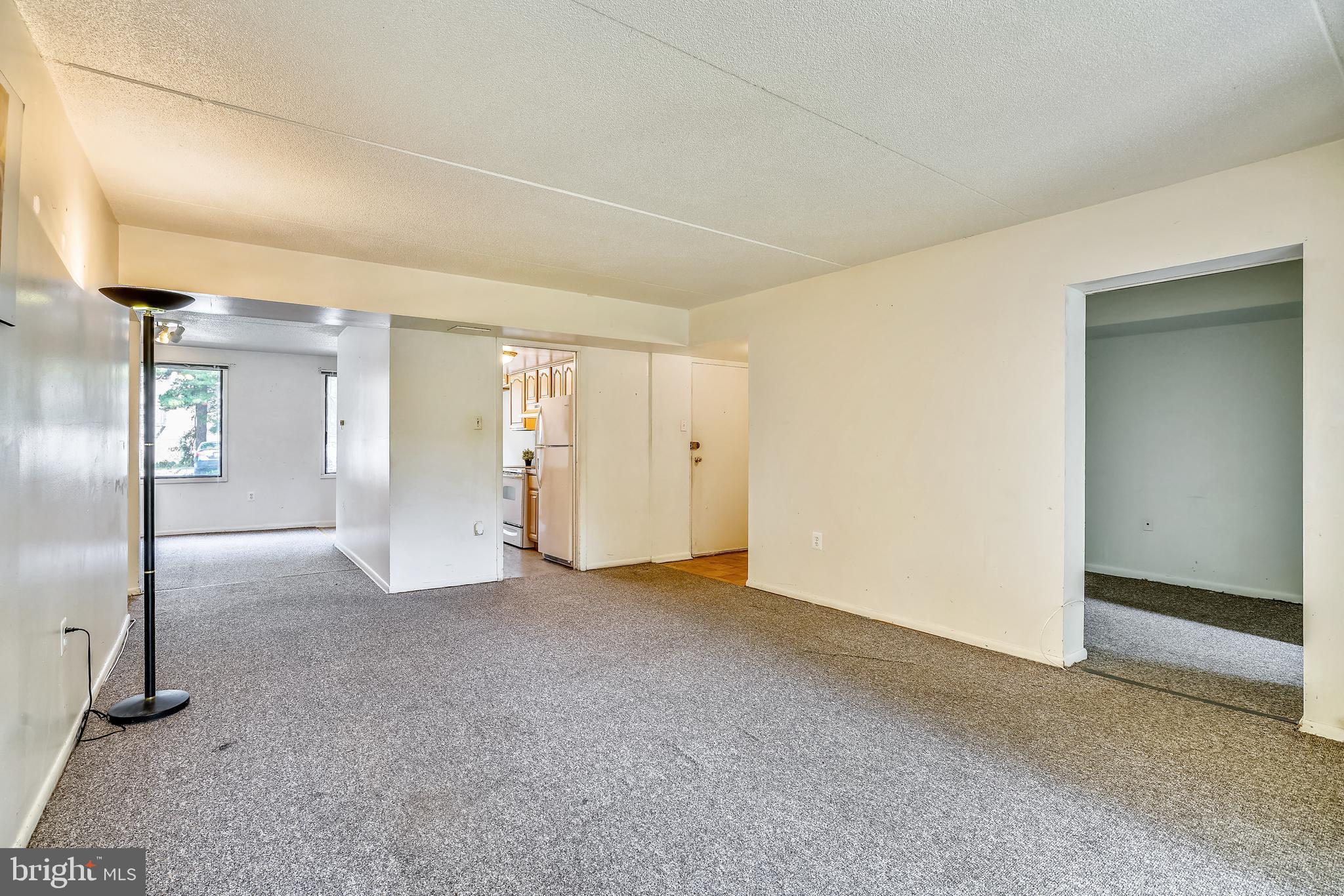 5234 West Running Brook Road, Unit 102 Columbia, MD 21044 - Photo 8 of 44 Living room with den off to the right side