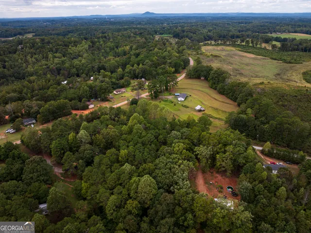 an aerial view of residential house with outdoor space and river