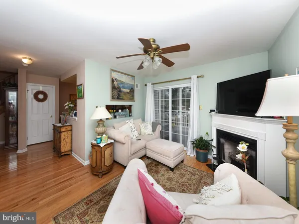 a living room with furniture fireplace and a flat screen tv