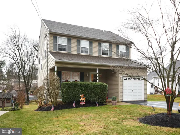 a view of a house with a yard and plants