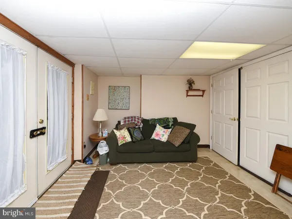 a living room with furniture and a rug