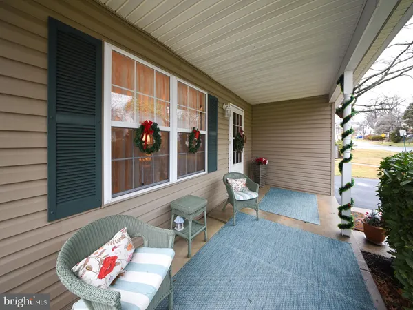 a view of a patio with table and chairs and potted plants