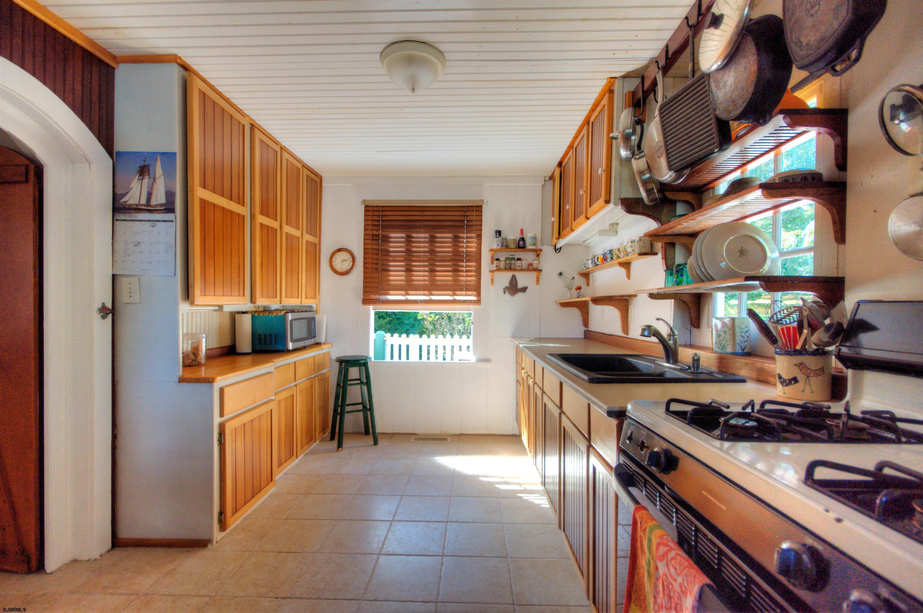 115 Rte 50 Woodbine, NJ 08270 - Photo 16 of 56 a kitchen with stainless steel appliances granite countertop a stove and a refrigerator