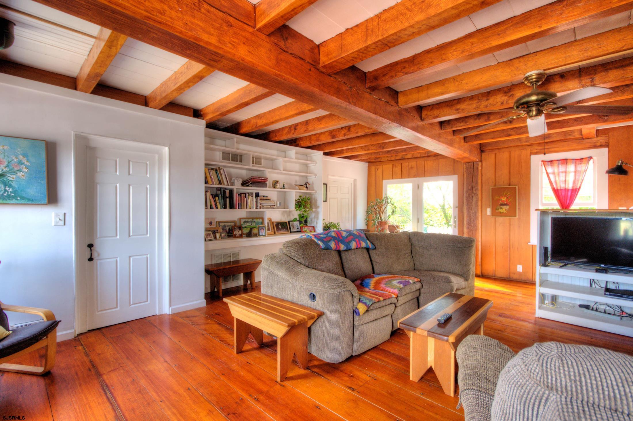 115 Rte 50 Woodbine, NJ 08270 - Photo 23 of 56 a living room with furniture and a flat screen tv