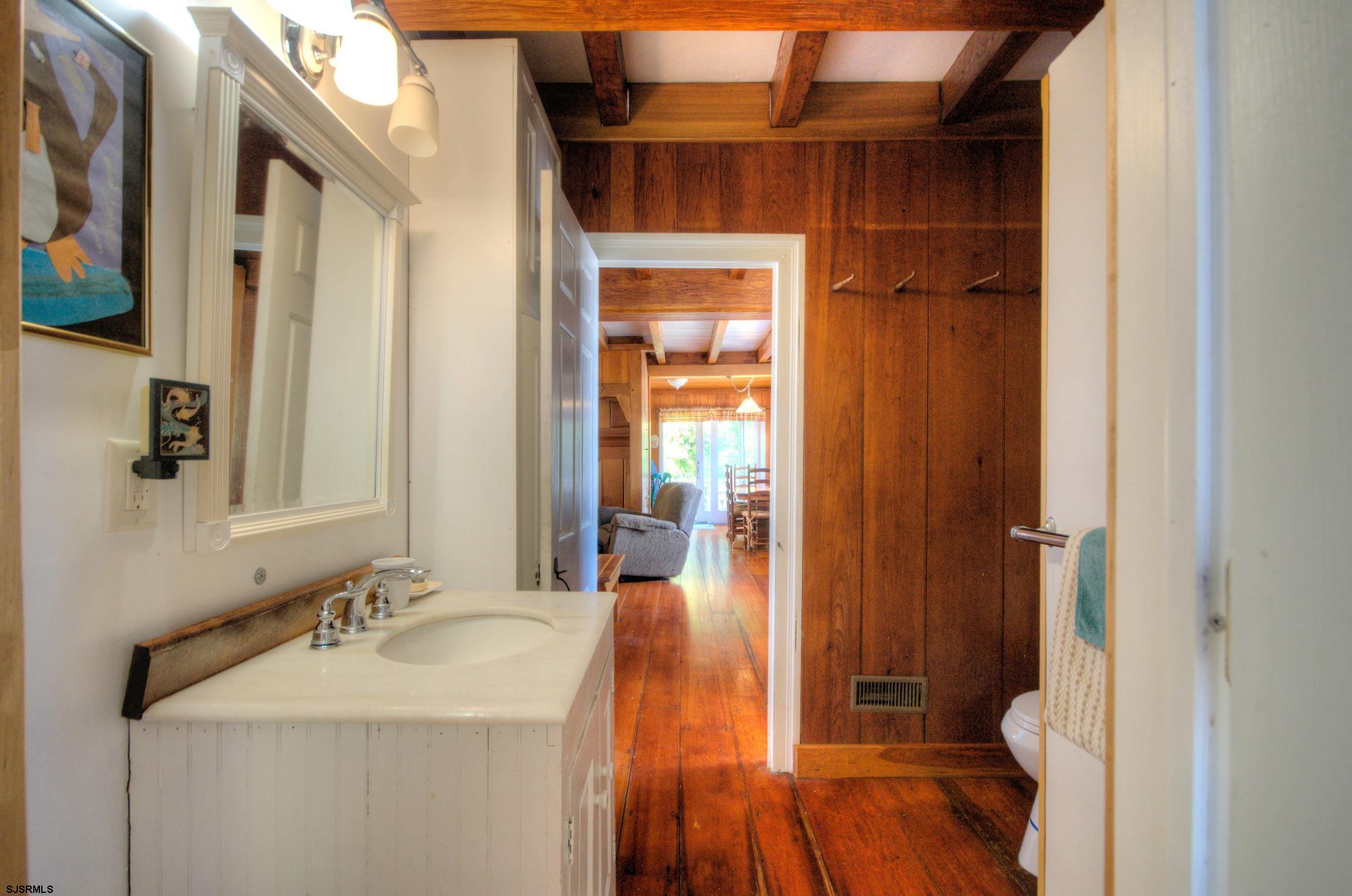 115 Rte 50 Woodbine, NJ 08270 - Photo 29 of 56 a bathroom with a sink a toilet and shower