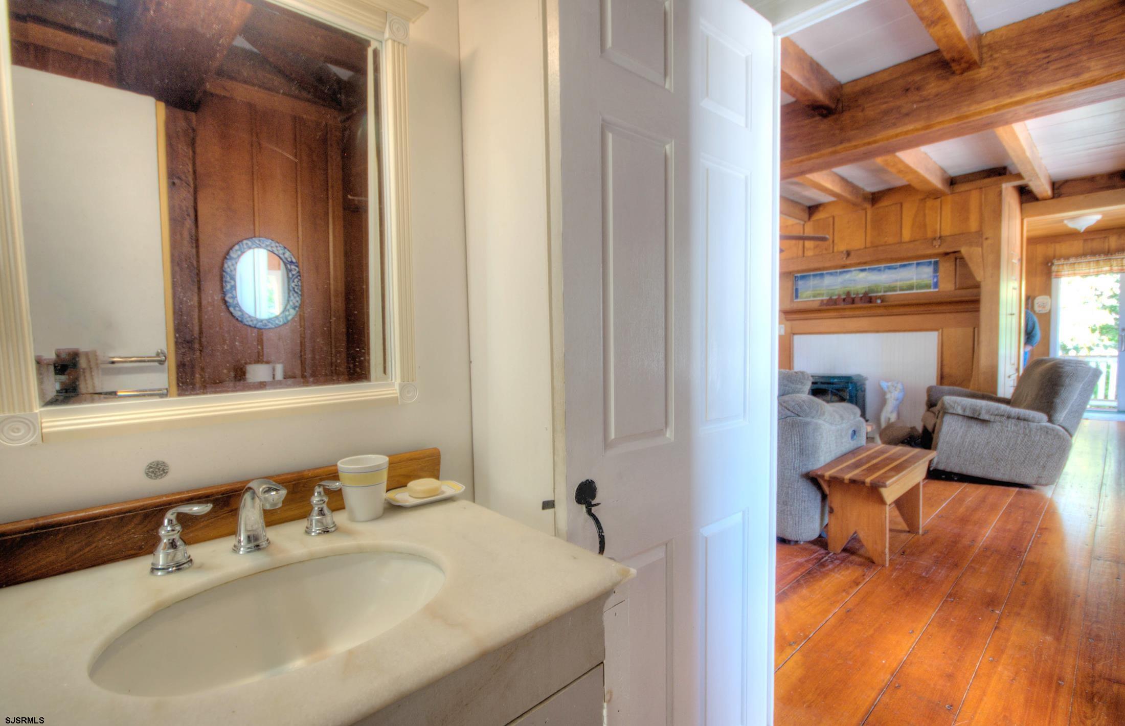 115 Rte 50 Woodbine, NJ 08270 - Photo 31 of 56 a en suite bathroom with a sink and a mirror