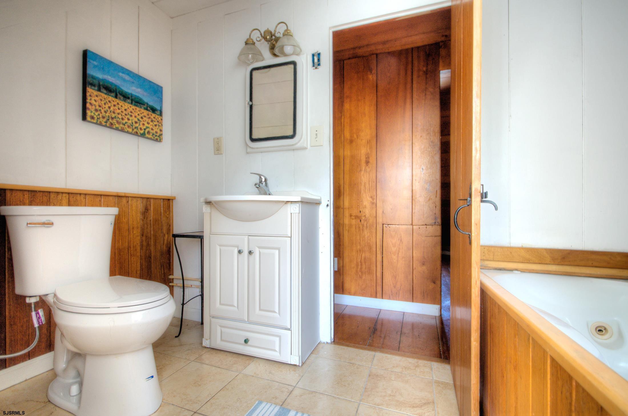 115 Rte 50 Woodbine, NJ 08270 - Photo 40 of 56 a bathroom with a toilet sink and tub