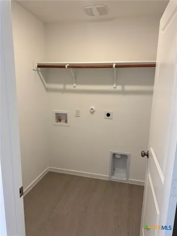 an entryway door with a hallway in the back
