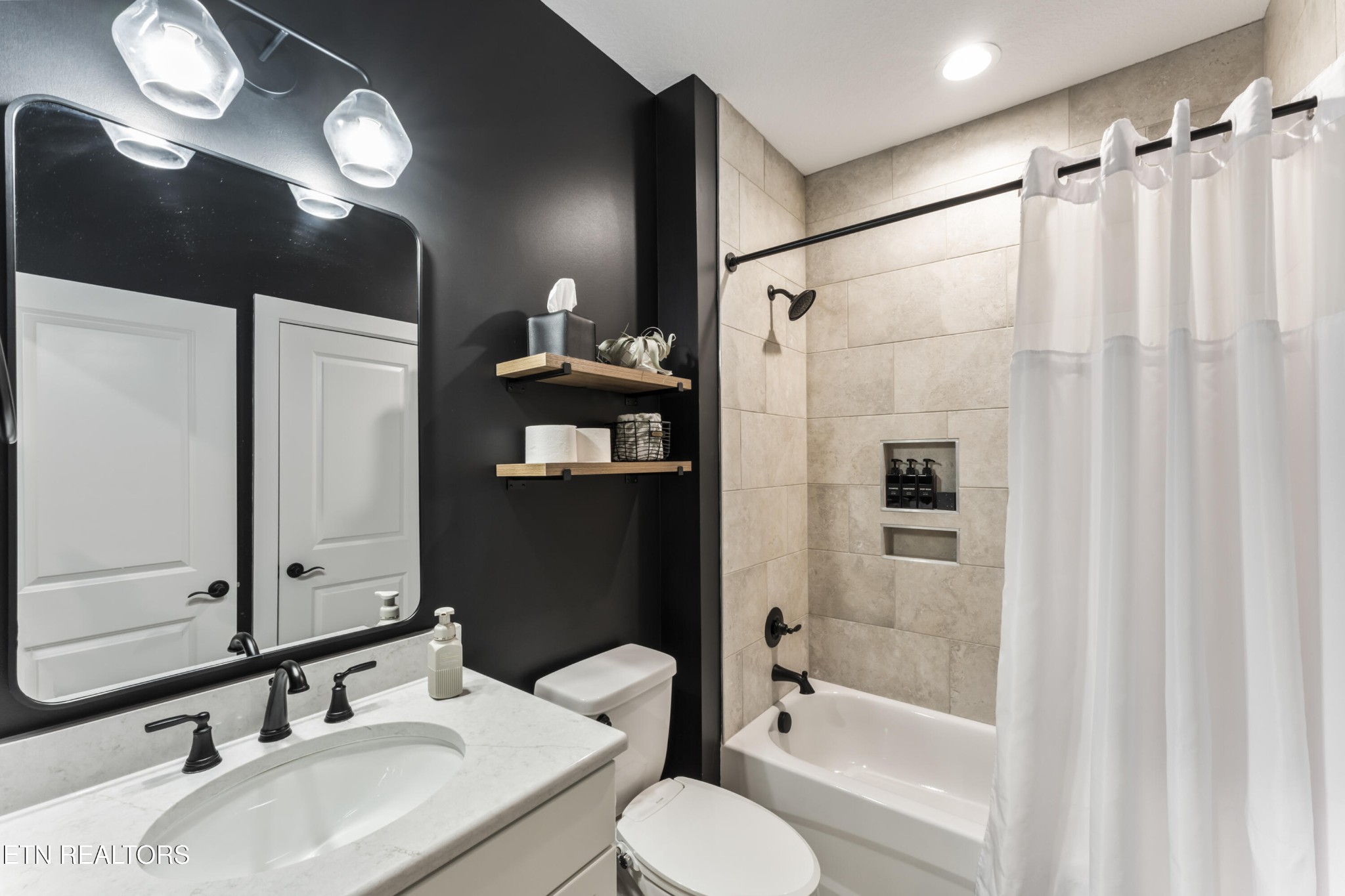2815 Green Summers Road Knoxville, TN 37938 - Photo 17 of 50 a bathroom with a sink vanity granite tub shower and a mirror