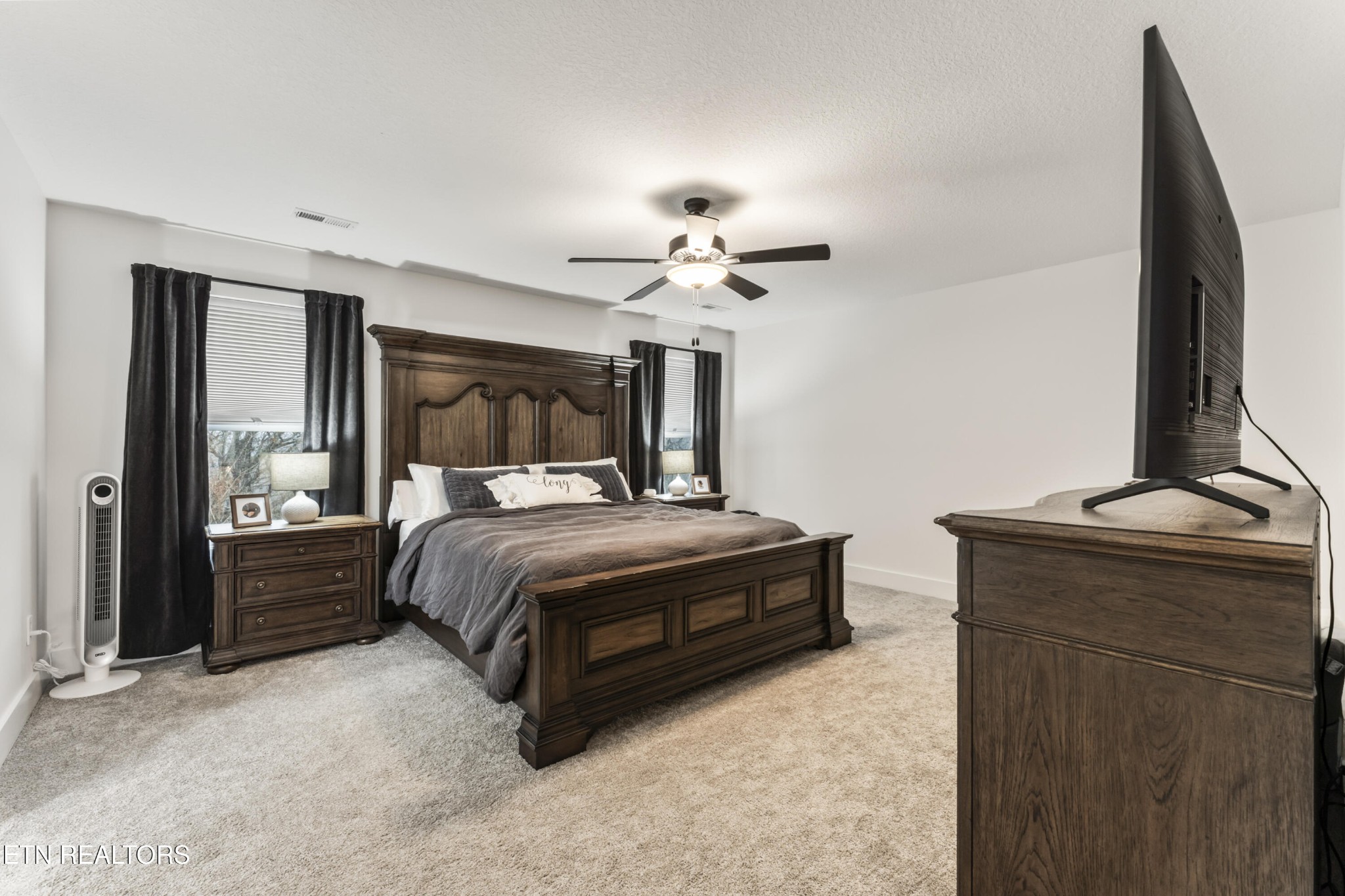 2815 Green Summers Road Knoxville, TN 37938 - Photo 21 of 50 a bedroom with a bed and a chandelier