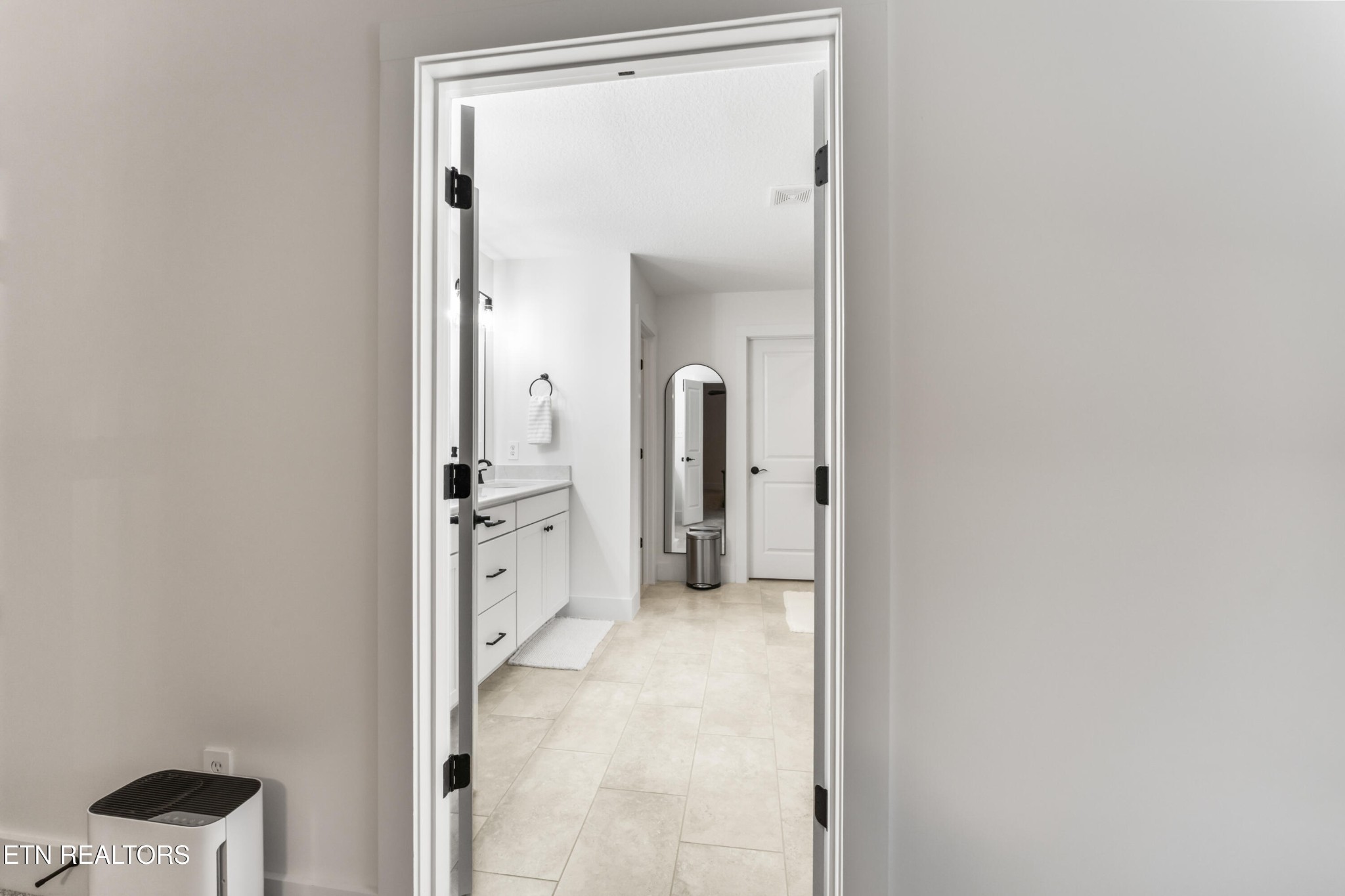 2815 Green Summers Road Knoxville, TN 37938 - Photo 23 of 50 a view of a hallway with closet and mirror