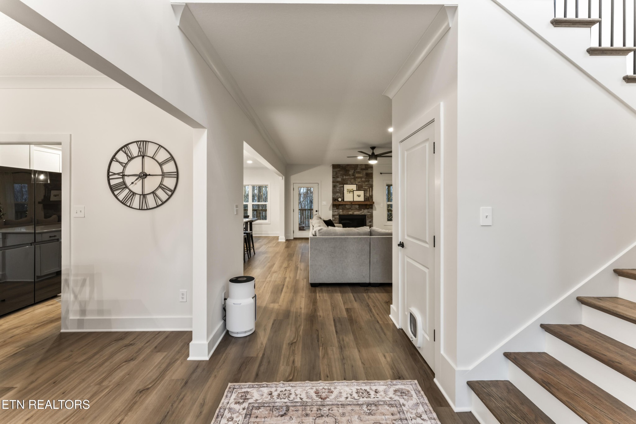 2815 Green Summers Road Knoxville, TN 37938 - Photo 4 of 50 a view of a hallway with wooden floor and a living room