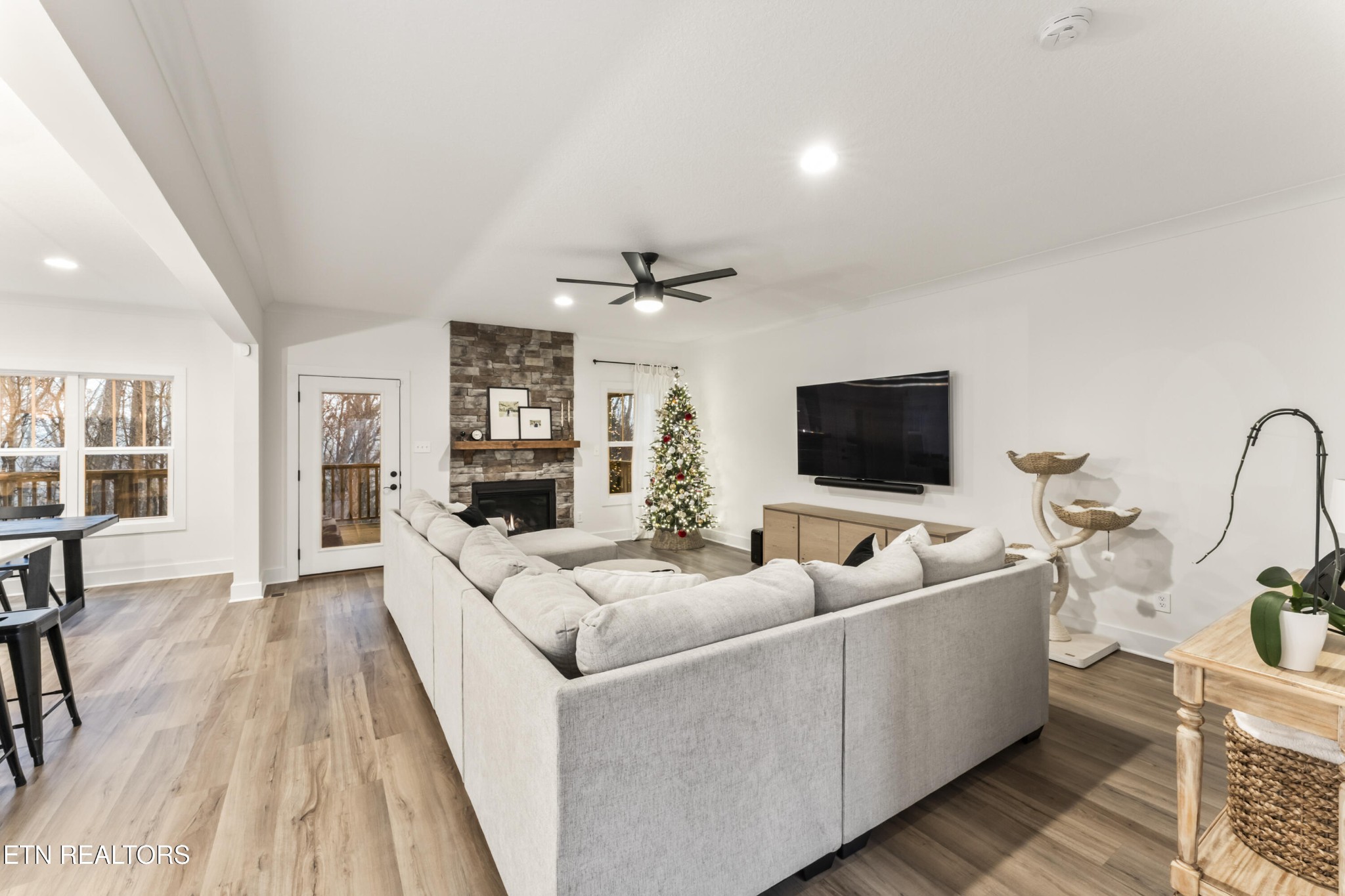 2815 Green Summers Road Knoxville, TN 37938 - Photo 8 of 50 a living room with furniture and a flat screen tv