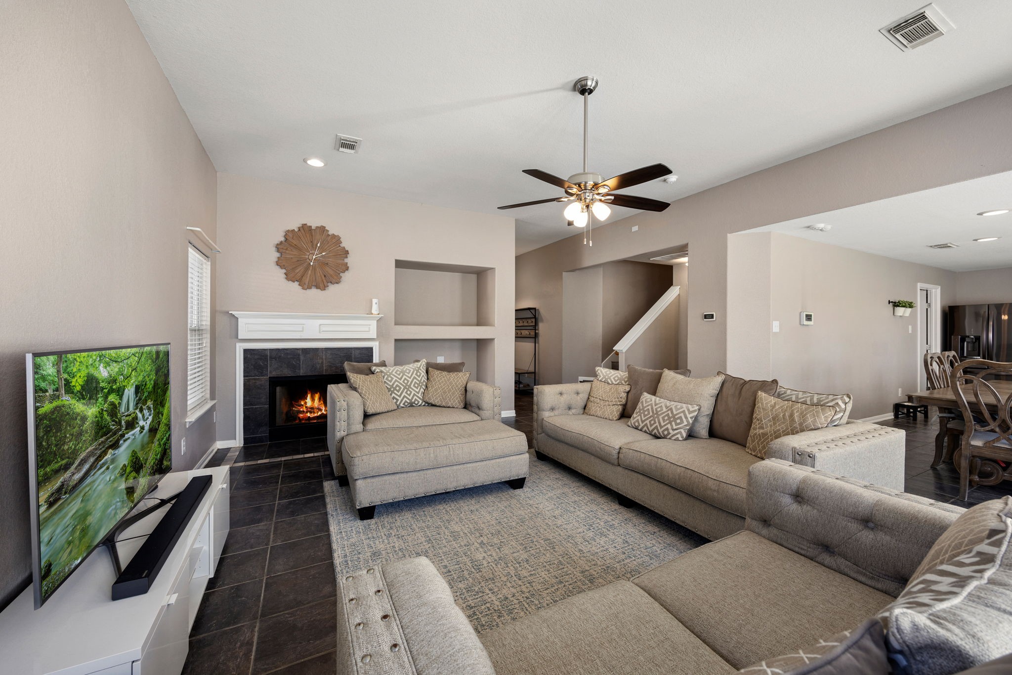 25515 Twister Trail Spring, TX 77373 - Photo 11 of 33 This warm and inviting living room seamlessly flows into the dining area. Highlighted by a cozy fireplace. It is the perfect place for both relaxation and entertaining.