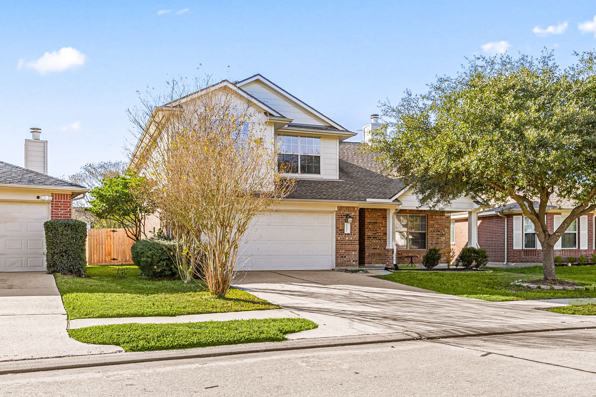 25515 Twister Trail Spring, TX 77373 - Photo 3 of 33 Additional view of the home demonstrating the mature trees and gabled roof