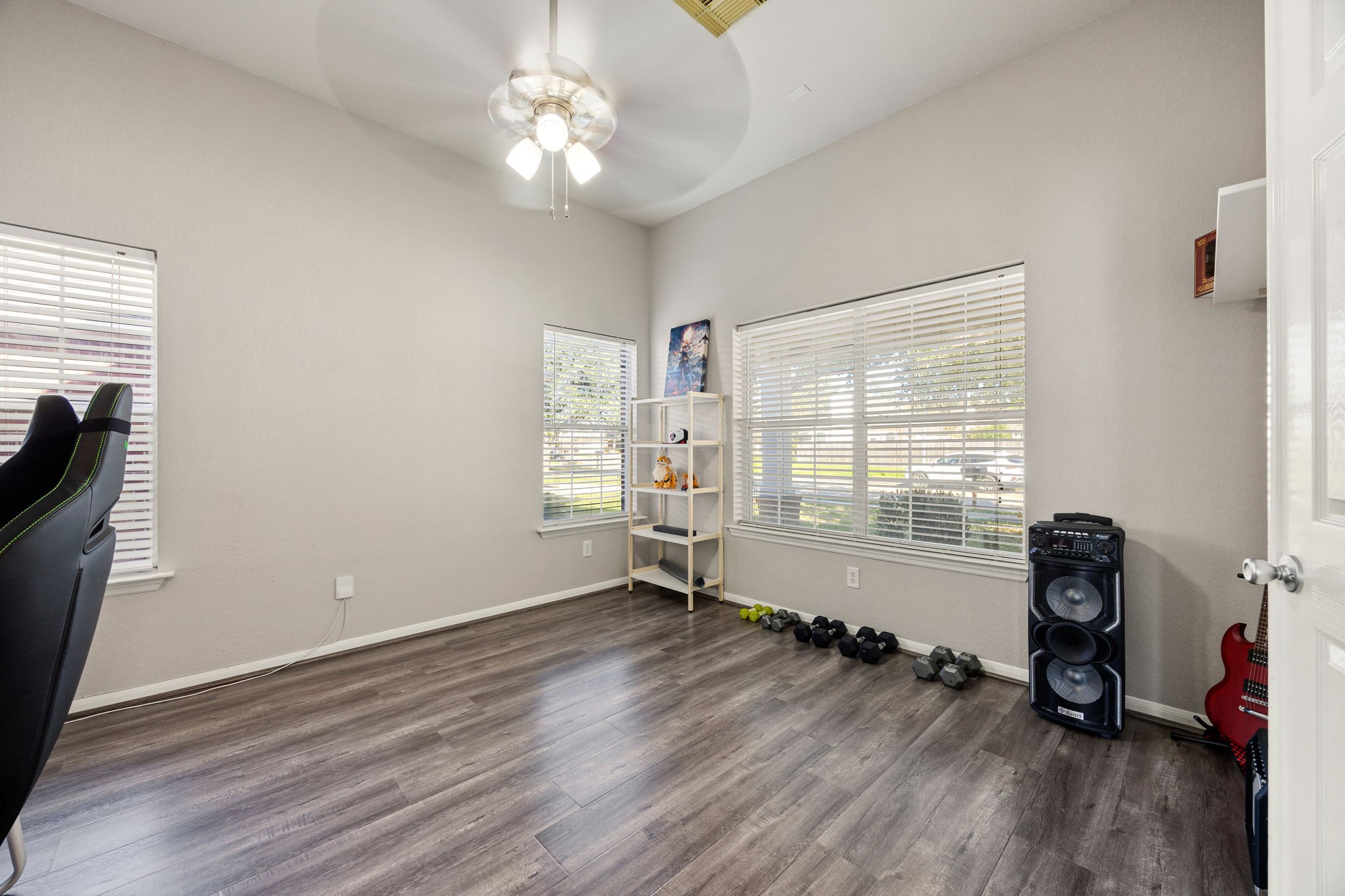 25515 Twister Trail Spring, TX 77373 - Photo 9 of 33 Bright, versatile roomin the front of the home with large windows, ceiling fan, and wood flooring. Ideal for a home office or gym.