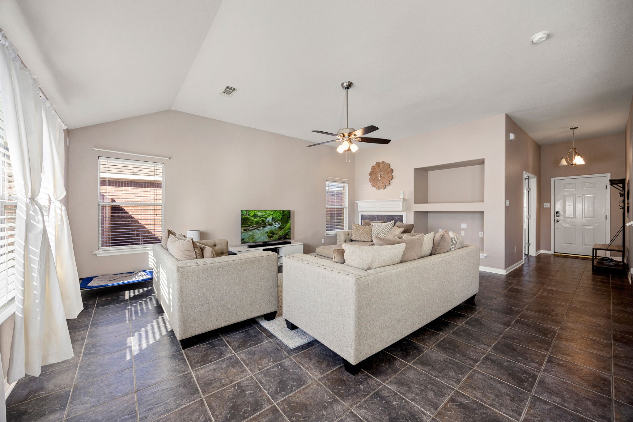 25515 Twister Trail Spring, TX 77373 - Photo 10 of 33 Discover a large bright and airy 23x18 living room, bathed in natural light and featuring oversized tile flooring.