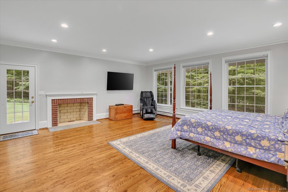 152 Cheney Lane Coventry, CT 06238 - Photo 13 of 45 a living room with furniture and a flat screen tv