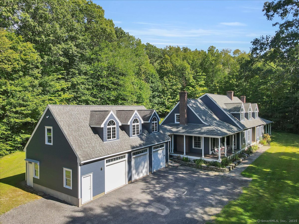 152 Cheney Lane Coventry, CT 06238 - Photo 25 of 45 a view of a house with a big yard plants and large trees