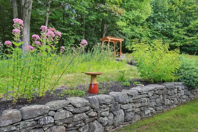 a backyard of a house with lots of green space