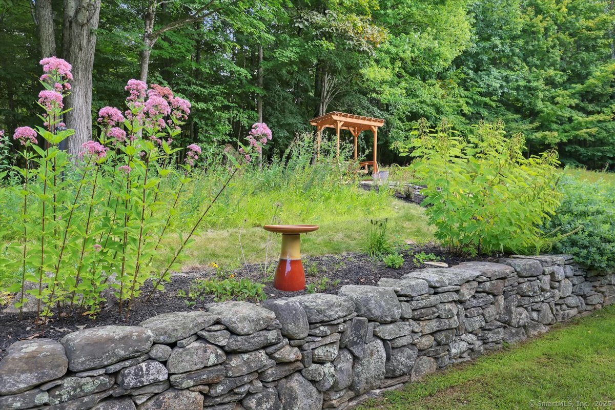 152 Cheney Lane Coventry, CT 06238 - Photo 28 of 39 a backyard of a house with lots of green space
