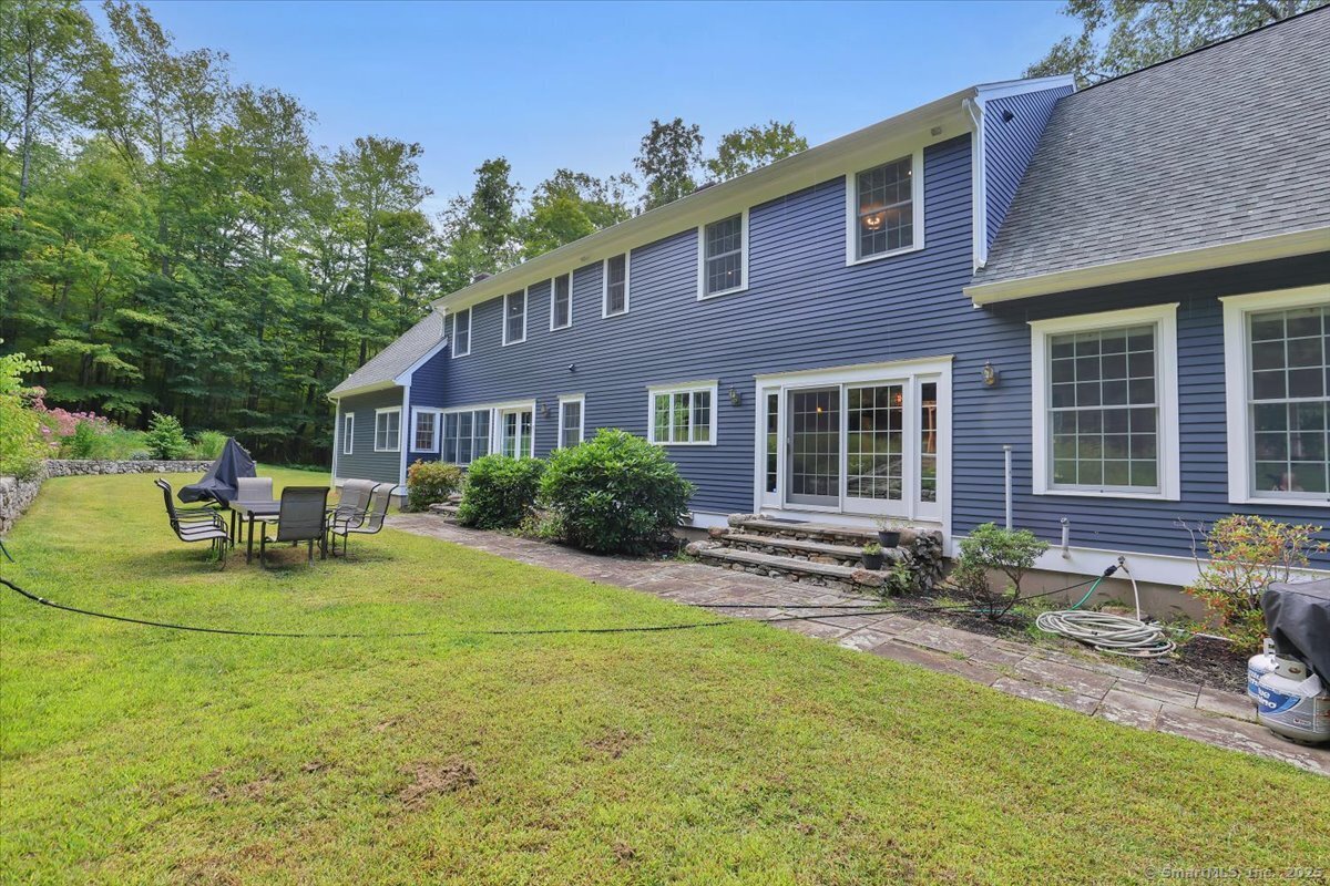 152 Cheney Lane Coventry, CT 06238 - Photo 29 of 45 a view of a house with a patio