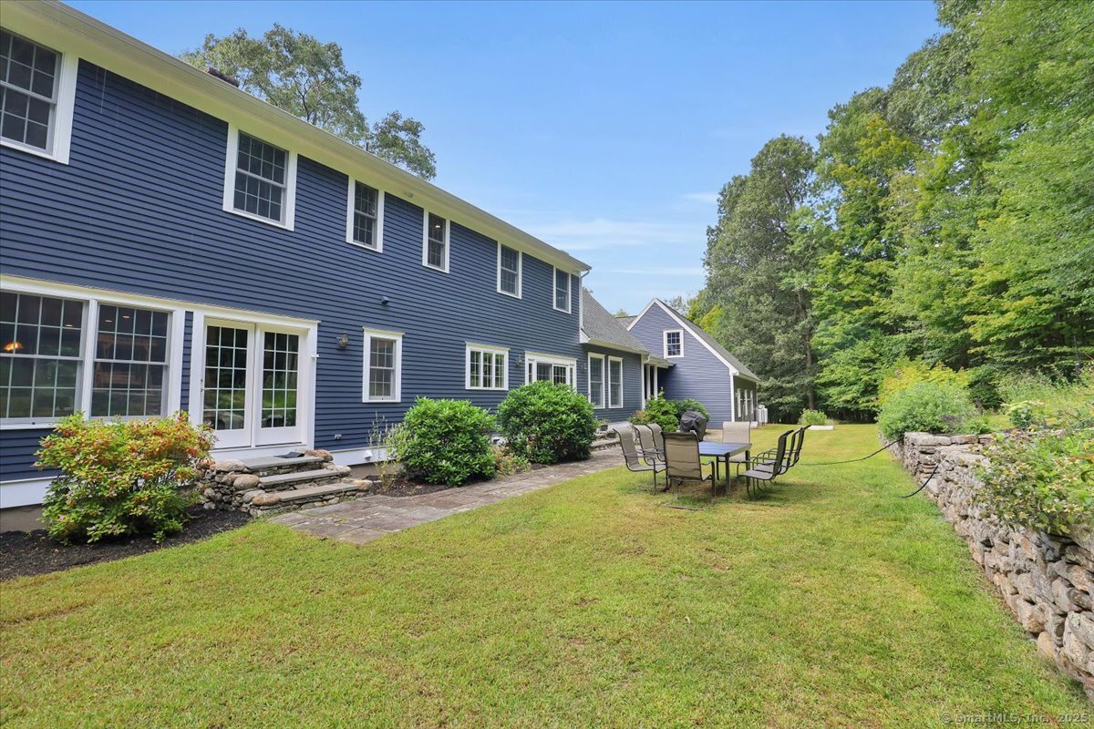 152 Cheney Lane Coventry, CT 06238 - Photo 31 of 45 a front view of a house with garden and porch