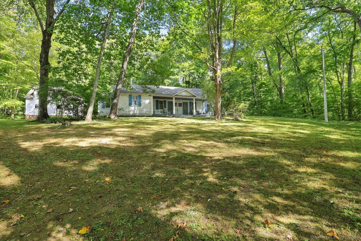 152 Cheney Lane Coventry, CT 06238 - Photo 34 of 45 a front view of a house with a big yard