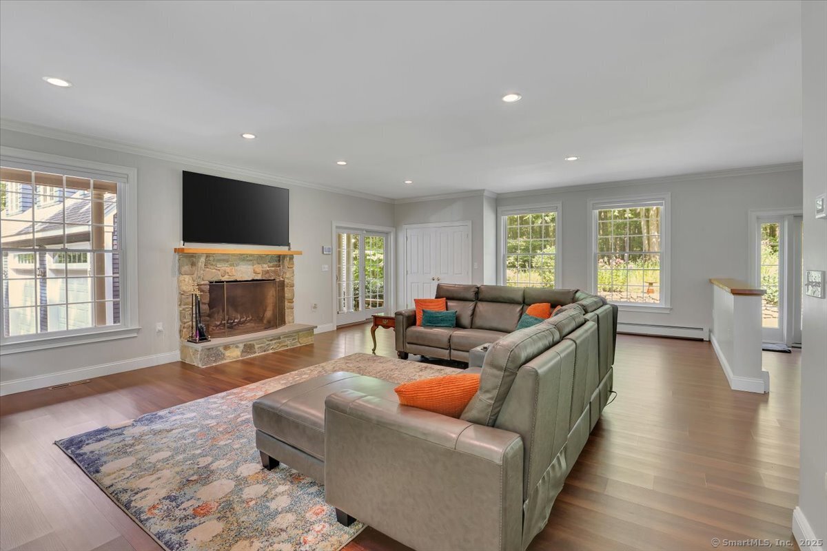 152 Cheney Lane Coventry, CT 06238 - Photo 7 of 45 a living room with furniture window and a fireplace