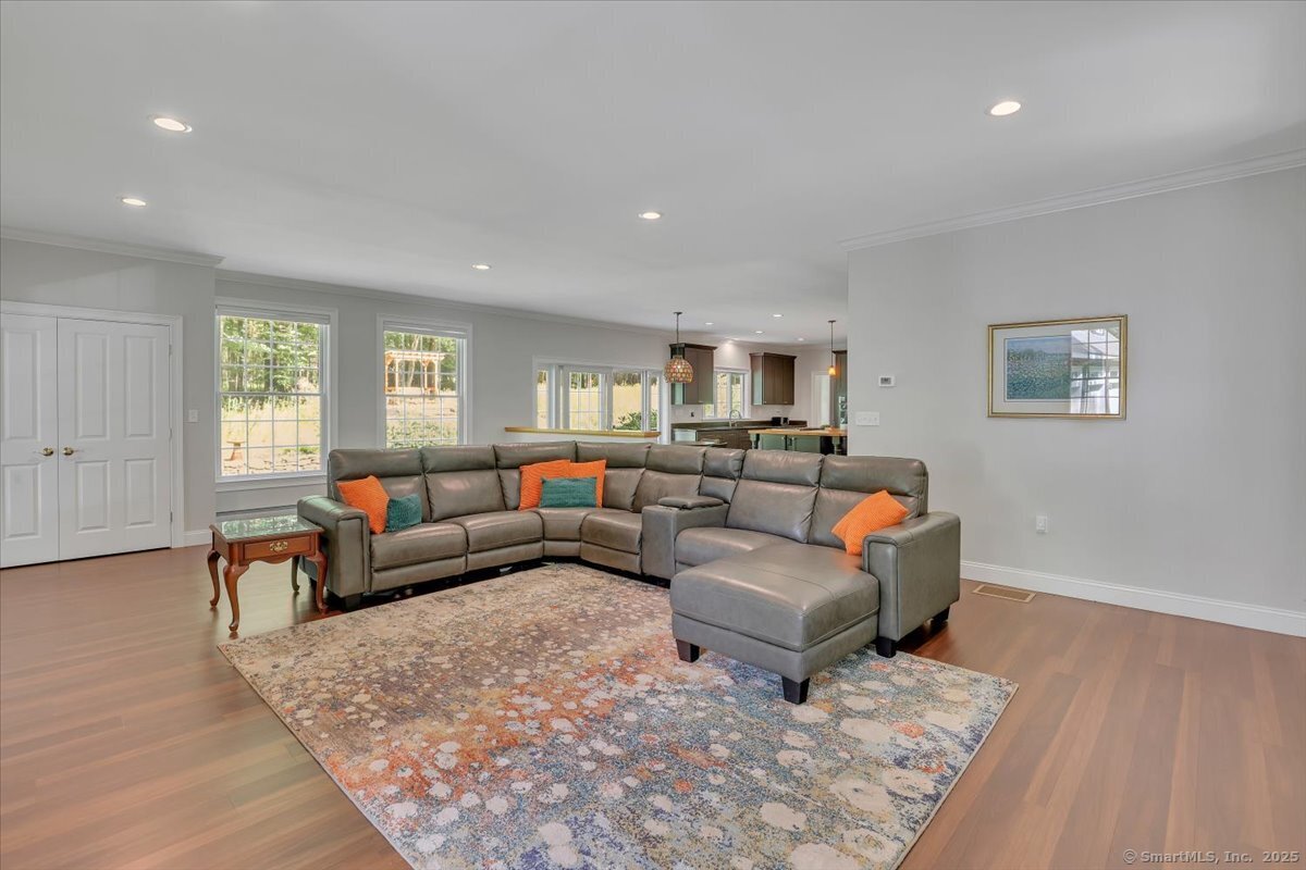 152 Cheney Lane Coventry, CT 06238 - Photo 8 of 45 a living room with furniture and wooden floor