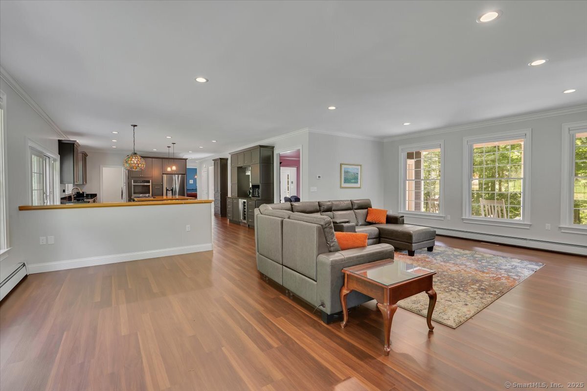 152 Cheney Lane Coventry, CT 06238 - Photo 9 of 45 a living room with furniture and a wooden floor