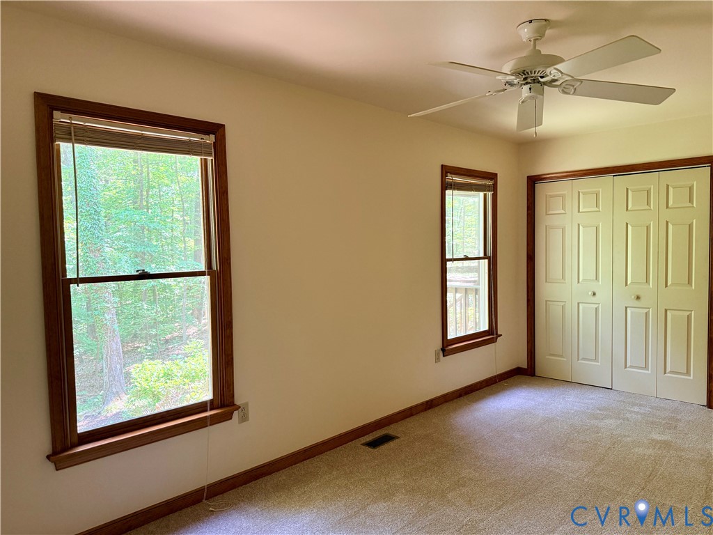 2590 Davis Mill Road Goochland, VA 23063 - Photo 17 of 33 an empty room with windows and closet
