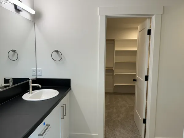 a bathroom with a sink double vanity and a mirror