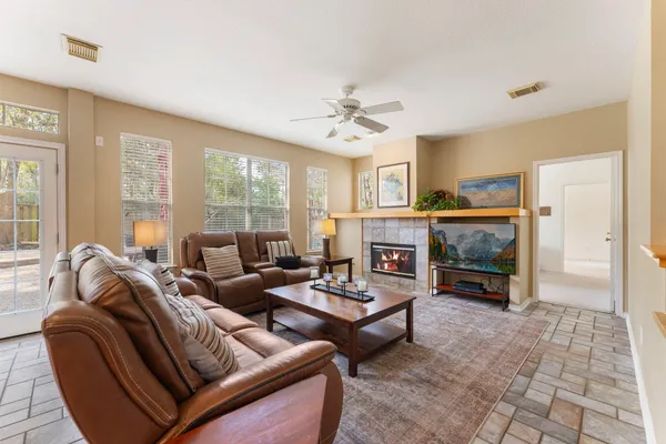 a living room with furniture and a fireplace