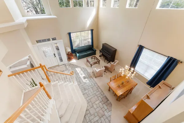 a view of a living room with furniture and a flat screen tv