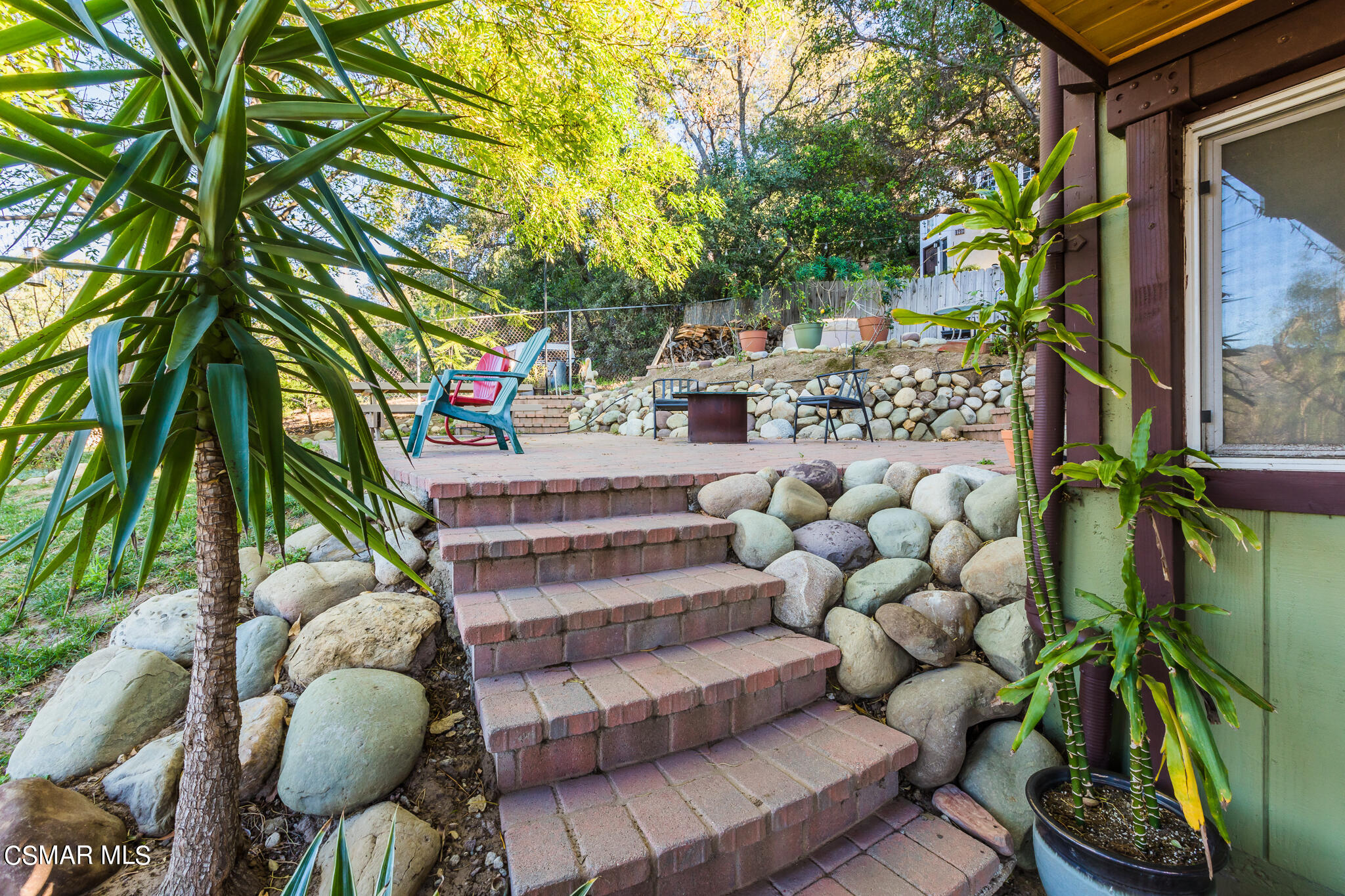 6695 Clear Springs Road Simi Valley, CA 93063 - Photo 13 of 94 a backyard of a house with lots of green space and glass windows