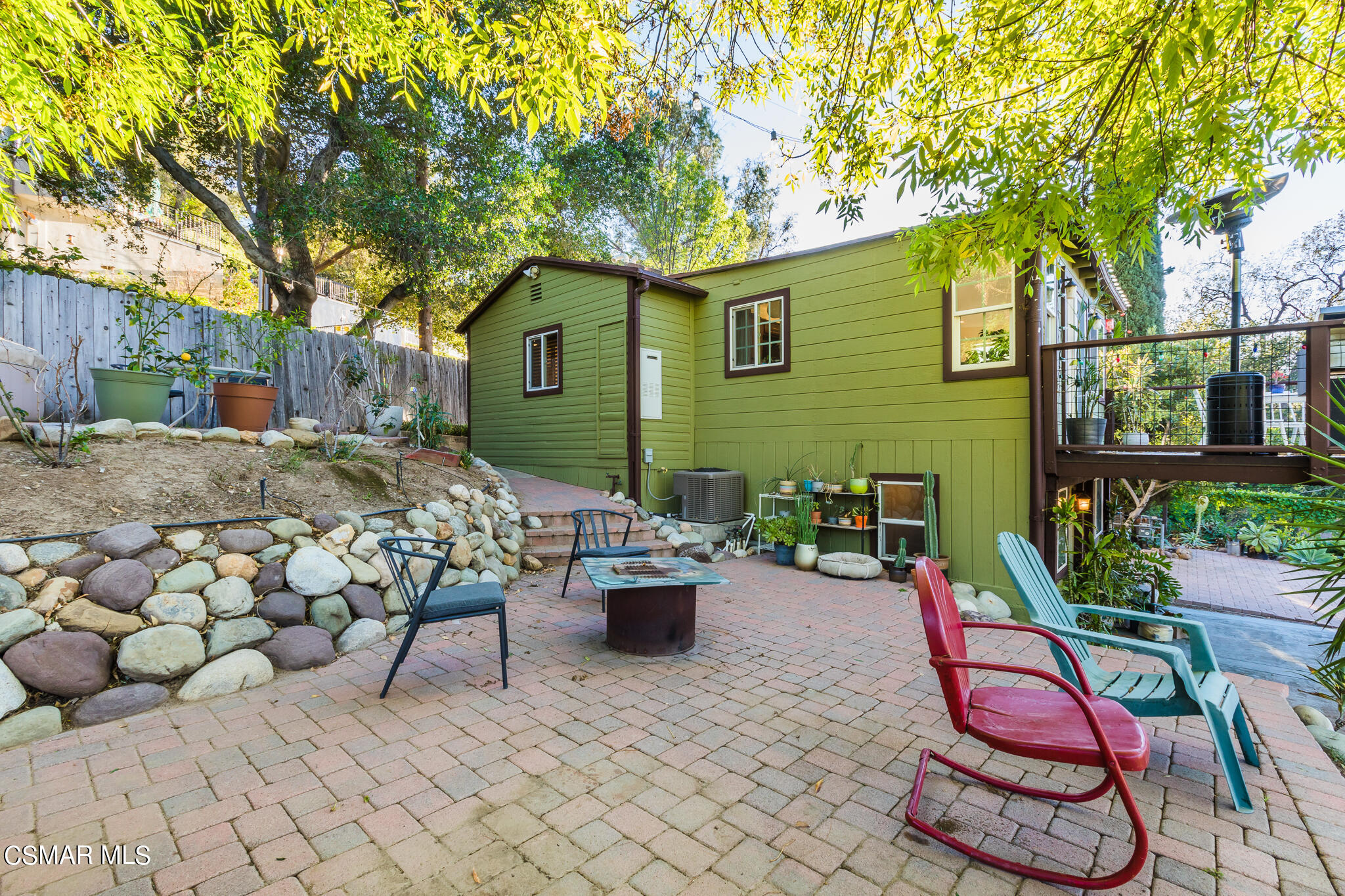 6695 Clear Springs Road Simi Valley, CA 93063 - Photo 15 of 94 a view of a chairs and table in backyard of the house